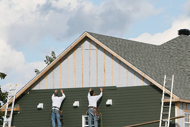 Professional Siding technician working in Parkville, MD